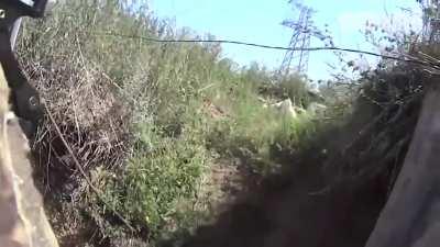 UA soldiers working on clearing Russian trench