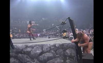 Scott Hall selling The Giant demolishing the ring.