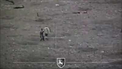 Ukrainian kamikaze drone hits two Russian soldiers who tries fighting it with a shovel. March 2024 (music from source)