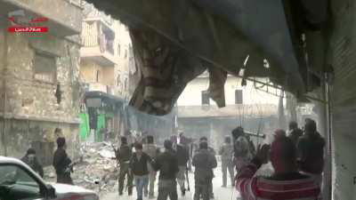 Large group of FSA fighters pull back from an operation to take Aleppo International Stadium - 2012