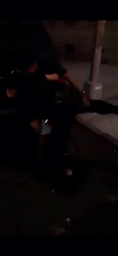 NYPD cop gets put in a headlock After lunging at a bystander