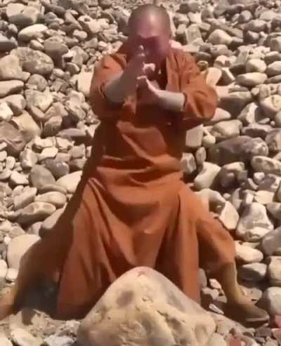 This is how a Shaolin monk smashes a rock with a single finger 