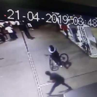 Man dodges bullets at close range when he's attacked at a gas station in Rio de Janiero