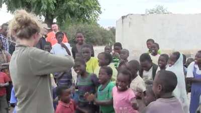 African children hearing fiddle music for the first time.