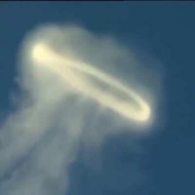 Mt. Etna blowing a steam ring.