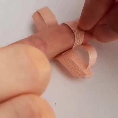 How to place a regular bandage over a knuckle