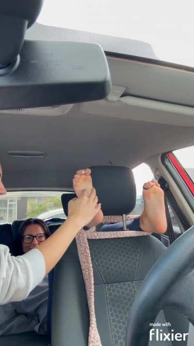 Tia feet tickled by Elisha in the car