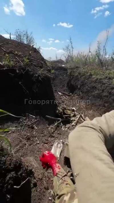 A Ukrainian soldier is wounded by an enemy from a distance of a couple of meters