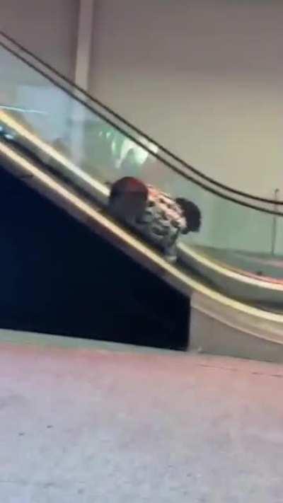 Drunk in Las Vegas against the escalator boss