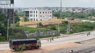 View of Gandipet water from Narsingi flyover located on ORR. Water is flowing through the ORR service road. I feel, new method of including long cylindrical pipes underneath the bridges lead to this situation. If there are no pipes, then water will flow f