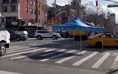 Truck having no respect for a tent, who is crossing the road