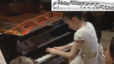 11 year old girl Alexandra Dovgan playing a fast pace piano concerto with crystal clear clarity and zero to no mistakes