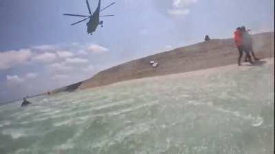 People's Liberation Army Navy Helicopter uses it's downdraft to prevent a Philippine Bureau of Fisheries and Aquatic Resources scientific survey team to do their job on an ocean feature well within the Philippine's Exclusive Economic Zone, that the PRC cl