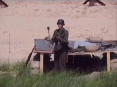 German soldier juggling grenades in Omaha Beach during World War II