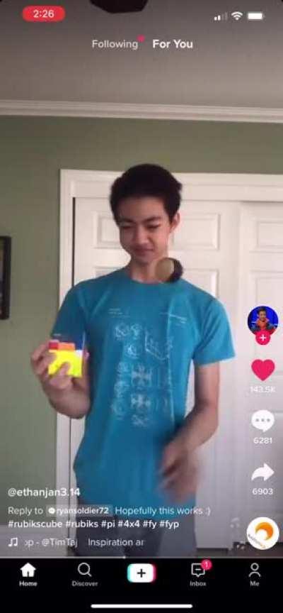 Solving a 4x4 Rubik’s cube with one hand while juggling with the other AND reciting 500 digits of pi in 2.5 minutes!