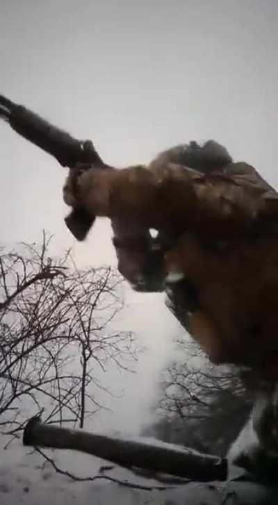 Ukrainian POV of soldiers firing at something from a trench with possible return fire. Reportedly near Bakhmut. (February 2023)