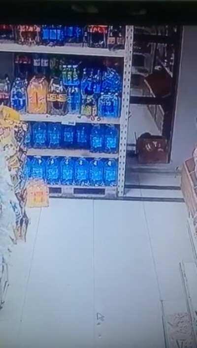 Bottle falls of the shelf but shoots itself back immediately