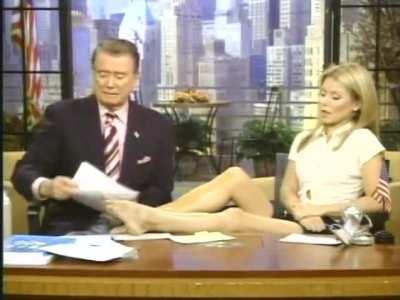 Having her legs tanned by Regis