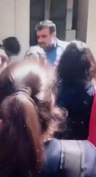 Iranian schoolgirls in Karaj remove their Hijabs today and force a male official out of the school