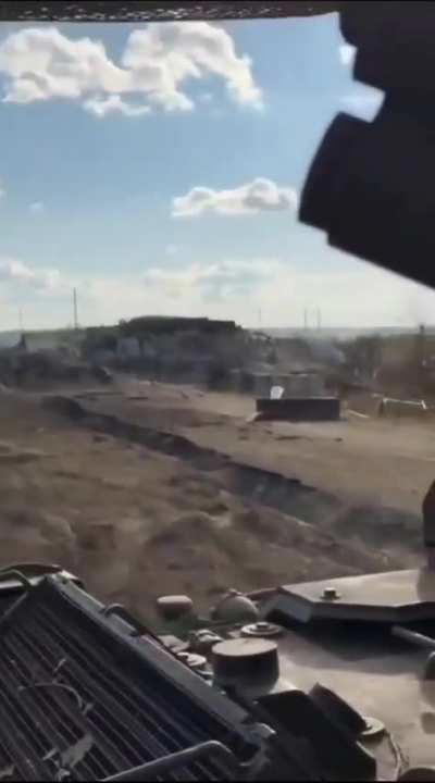 Ukrainian troops cross the Russian border driving past empty Russian fortifications on their M1126 Stryker