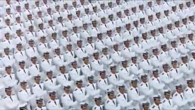 Marching in time while wearing white uniforms