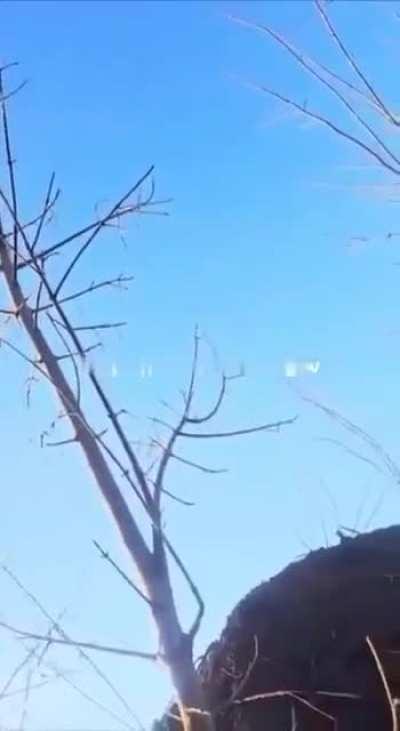 Russian soldier records the moment a Ukrainian FPV drone goes for his position