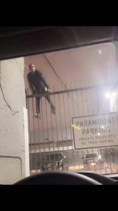 WCGW climbing over a fence