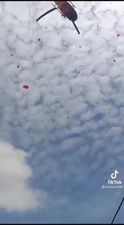 Funeral procession in Ipoh with helicopter scattering flower petals. Currently being investigated by the police