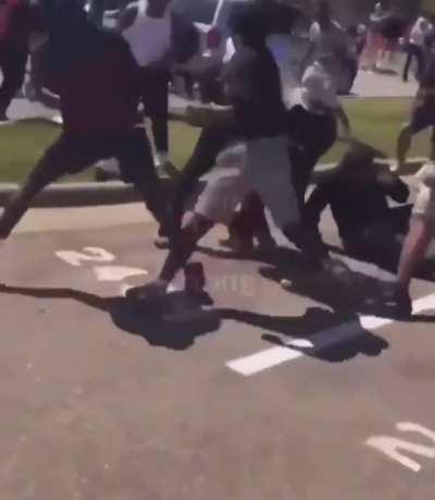 Big man fights off 15 people and knocks one of them out 