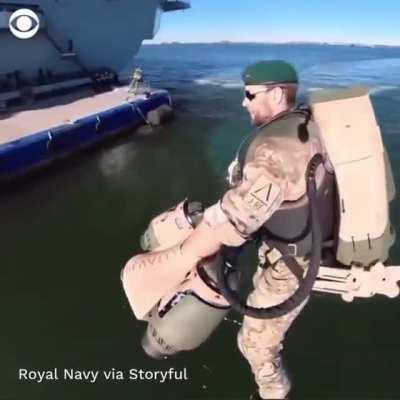 The British Royal Navy using jet suits to fly around HMS Elizabeth as it enters New York harbor.