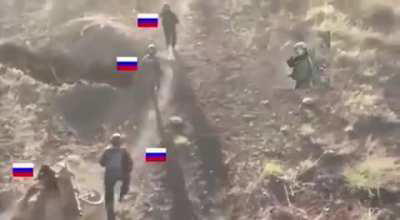 the Russians carry a wounded comrade, then drop him and run away after hearing the sound of a drone