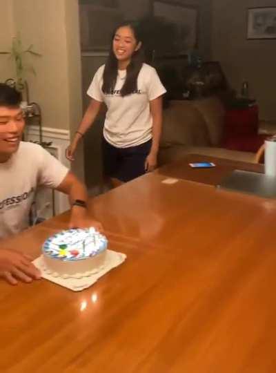 Smashing his face into a cake