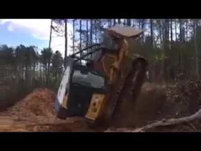 Guys backs a Dozer off a Hill...Flips Dozer Over.