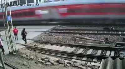 Rushing to cross the railroad and nearly getting hit