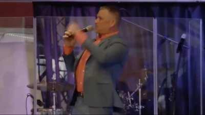 Insane antivaxx televangelist screams at his congregation 
