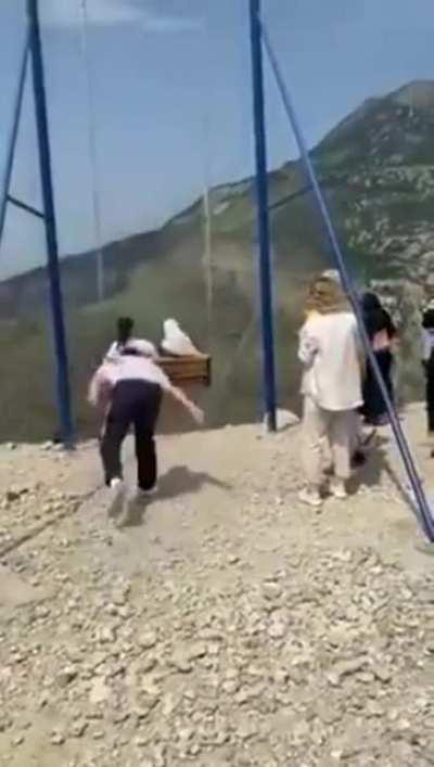 Two women falling off a 6000-ft cliff swing over the Sulak Canyon in Dagestan, Russia. Both women landed on a narrow decking platform under the edge of the cliff and miraculously survived with minor scratches.