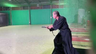 Samurai slicing baseball in half