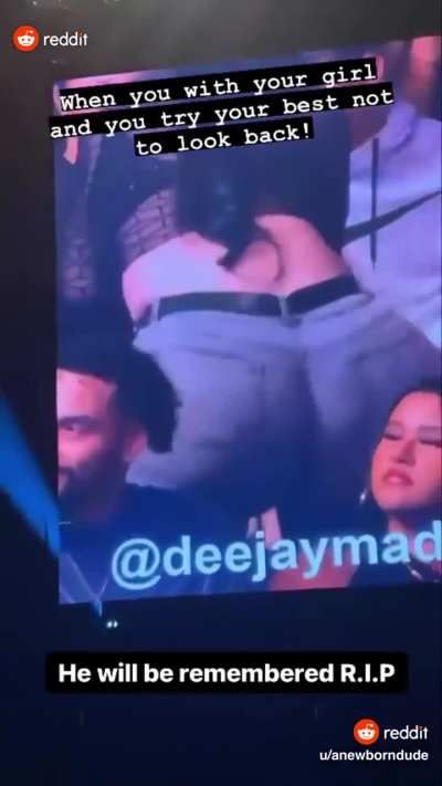 woman twerks right behind couple at concert