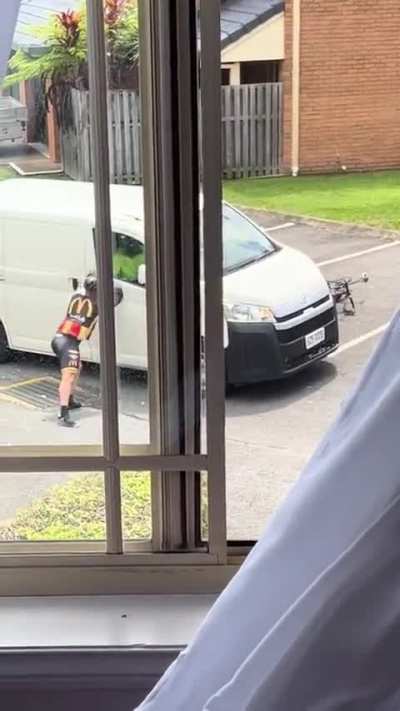 Footage of cyclist, postie fight goes viral in Queensland, Australia