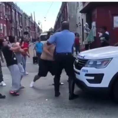 Female officer take down man that was punching her colleague