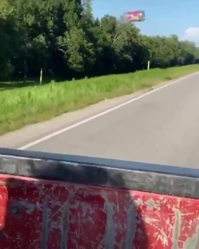 Aerodynamic drag pulling this plastic bottle behind a pick up truck