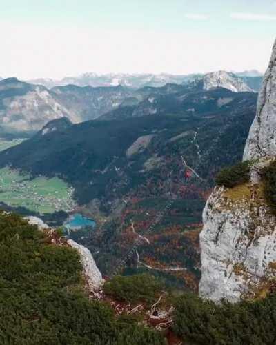 Austria installed a 45-meter cable ladder directly over a 700-meter drop. Here's a guy climbing it without fall protection.