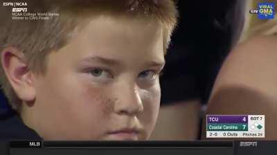 Kid has a staring contest with cameraman during game