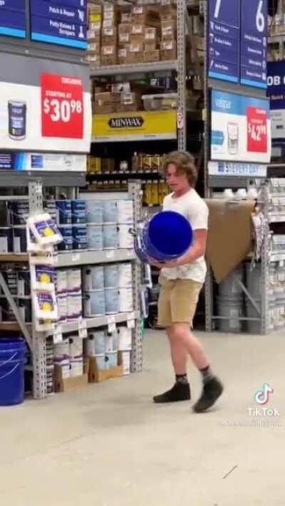 Guy puts bucket on different guy.