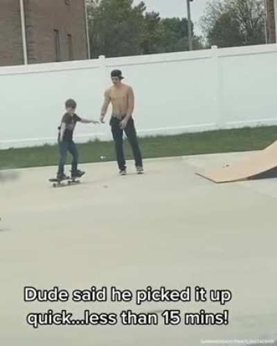 Big skate dude teaches little skate dude