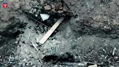 Russian tries to push an unexploded Ukrainian drone away from his dugout with catastrophic consequences.