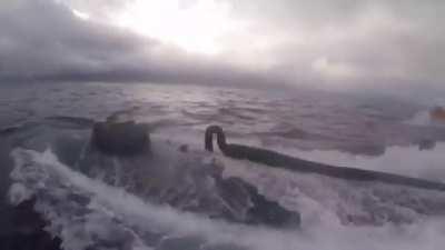 United States Coast Guard in the Eastern Pacific, boarding a narco-submarine carrying $232 million worth of cocaine.