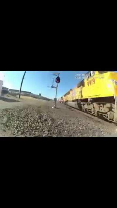 Officer saves wheelchair driver from train