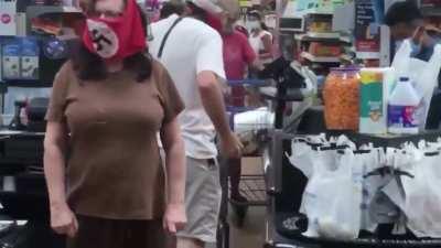 A Couple wears a Swastika mask at a Walmart