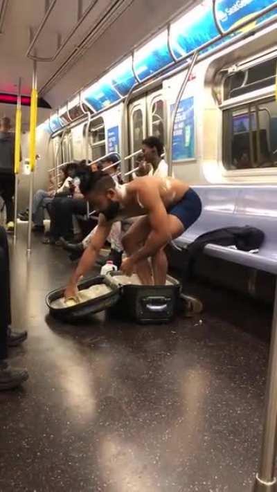 Man takes shower in subway